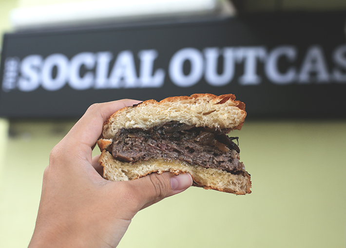 burger signboard shot the social outcast